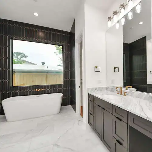 Modern Bathroom Design in Houston, TX with Marble-Look Tile and Accent Walls